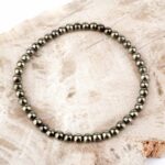 Rhodochrosit Navette Anhänger seitlich gebohrt mit schwarzem Satinband Edelsteine Heilsteine bei Wunderstein24